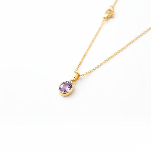 Amethyst pendant necklace with oval amethyst gemstone in gold-tone bezel setting on a fine gold chain